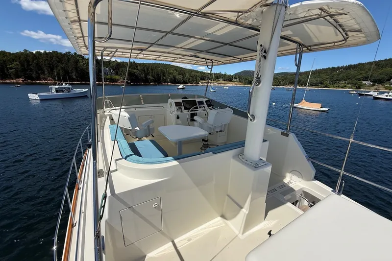Slide: The Image of 2013 York's Marine 46 Flybridge Cruiser on scenic water with clear skies. - 23