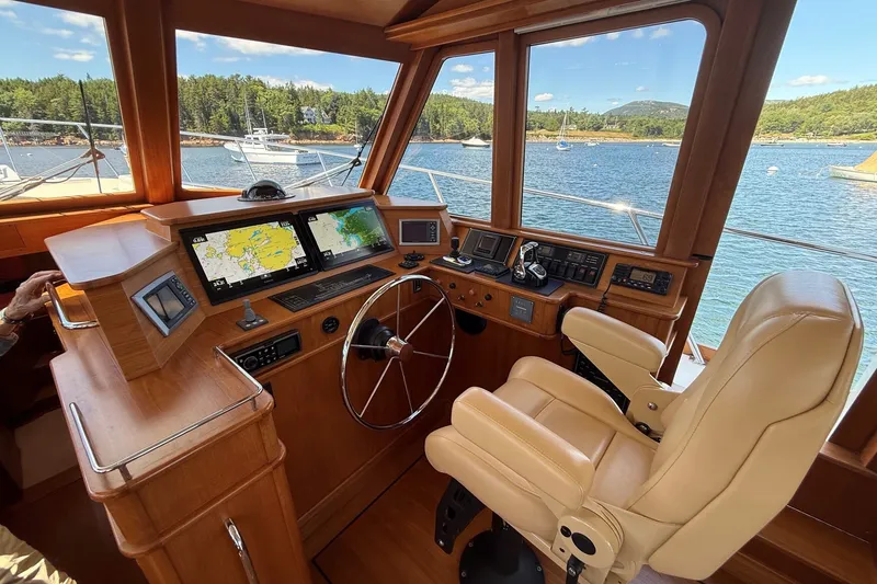 Slide: The Image of Helm of 2013 York's Marine 46 Flybridge Cruiser with navigation screens and leather chair. - 37