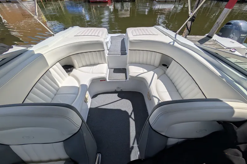 Slide: The Image of Interior of a 2006 Cobalt 262 boat with white leather seating. - 9