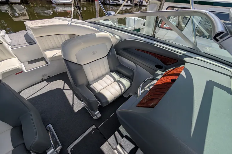 Slide: The Image of Interior of a 2006 Cobalt 262 boat with luxurious seating and sleek dashboard design. - 5