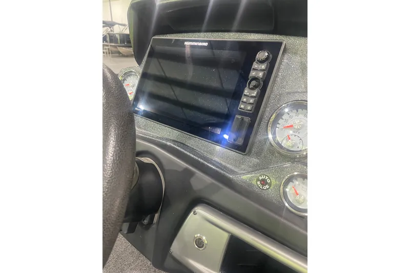 Slide: The Image of Dashboard of a 2020 Nitro Z21 boat featuring a Humminbird display and gauges. - 13