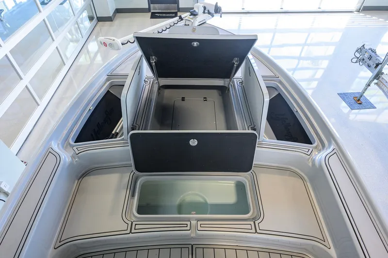 Slide: The Image of 2017 Yellowfin 24 Bay CE boat interior with open storage compartments. - 14