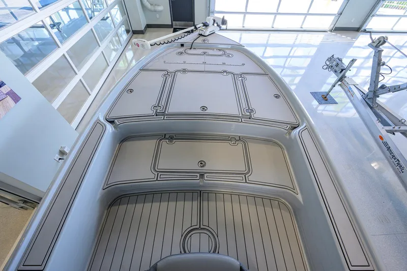 Slide: The Image of 2017 Yellowfin 24 Bay CE boat interior with sleek, modern design in a showroom. - 13