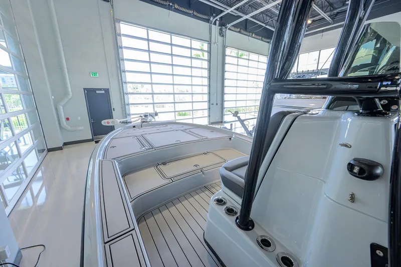 Slide: The Image of 2017 Yellowfin 24 Bay CE boat interior in showroom, showcasing sleek design and modern features. - 10