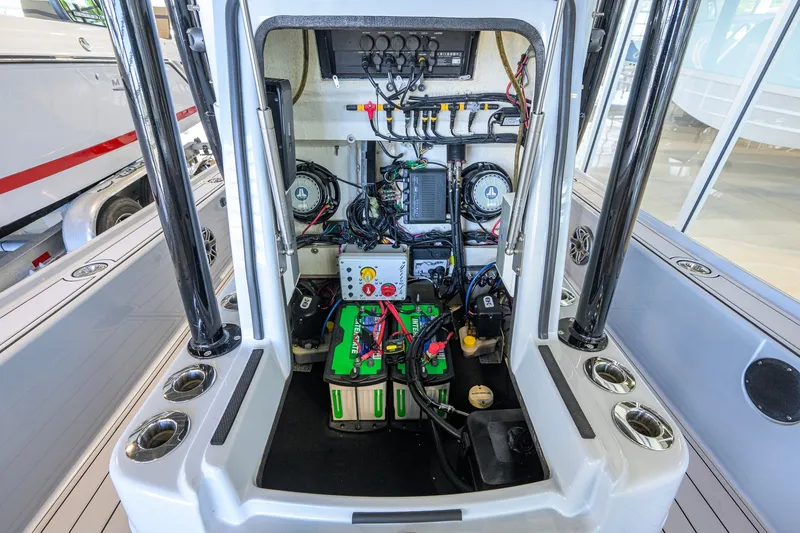 Slide: The Image of 2017 Yellowfin 24 Bay CE boat interior showing electrical components and wiring. - 45