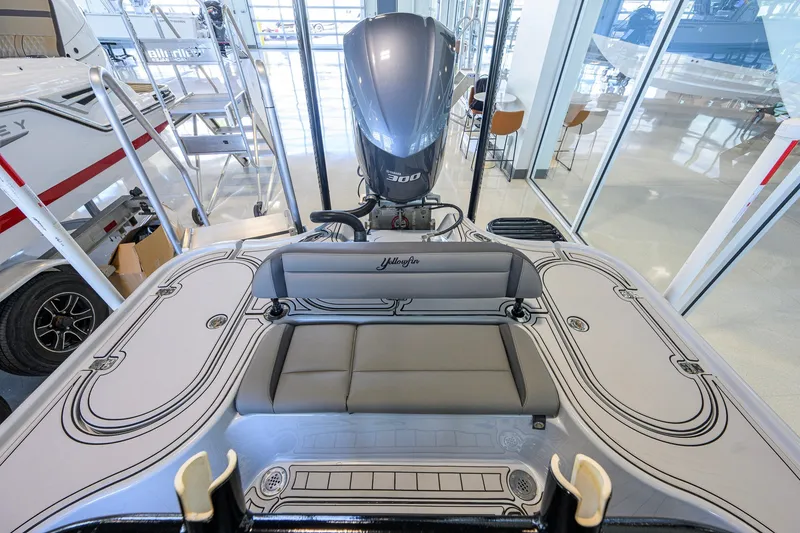 Slide: The Image of 2017 Yellowfin 24 Bay CE boat interior with seating and powerful engine. - 31