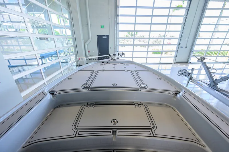 Slide: The Image of 2017 Yellowfin 24 Bay CE boat interior in a bright showroom. - 15