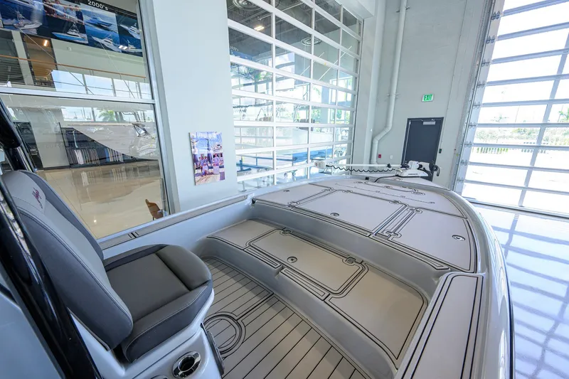 Slide: The Image of 2017 Yellowfin 24 Bay CE boat interior in showroom with modern design features. - 19