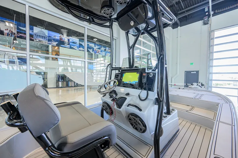 Slide: The Image of Interior of a 2017 Yellowfin 24 Bay CE boat with modern navigation equipment. - 24