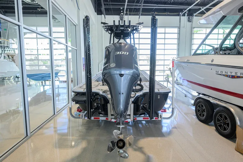 Slide: The Image of 2017 Yellowfin 24 Bay CE boat with powerful outboard motor in showroom. - 41