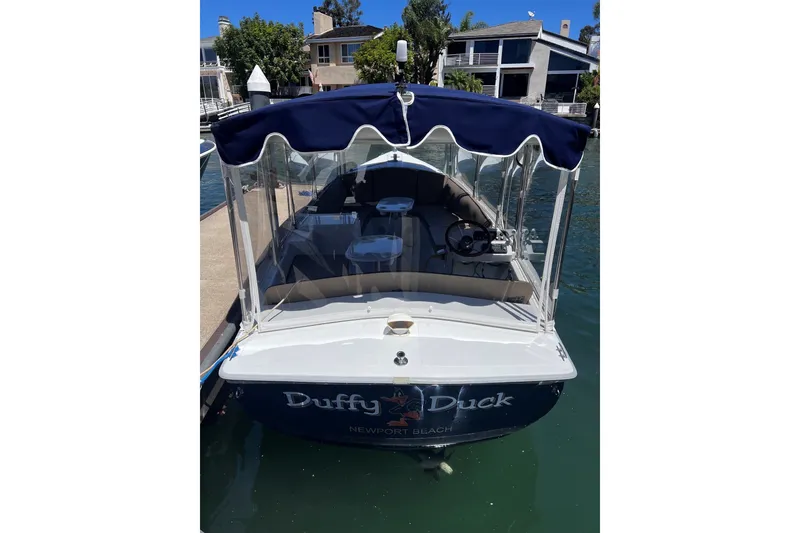 Slide: The Image of 2007 Duffy 21 Old Bay boat docked with blue canopy in Newport Beach. - 4