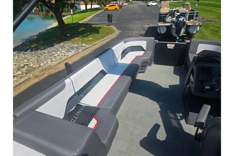 Slide: The Image of 2024 Manitou Cruise boat interior with sleek seating and modern design. - 18