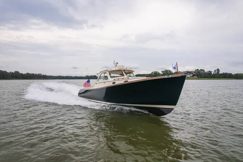 Slide: The Image of Hinckley Picnic Boat 36 Classic 2000 cruising on open water, displaying sleek design and speed. - 10