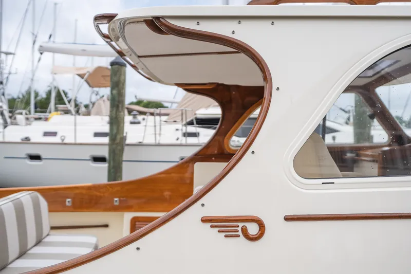 Slide: The Image of Hinckley Picnic Boat 36 Classic, 2000 model, showcasing elegant wood detailing and sleek design. - 64