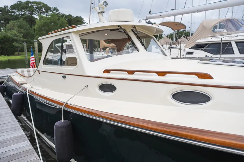 Slide: The Image of Hinckley Picnic Boat 36 Classic 2000 docked, showcasing elegant design and craftsmanship. - 63