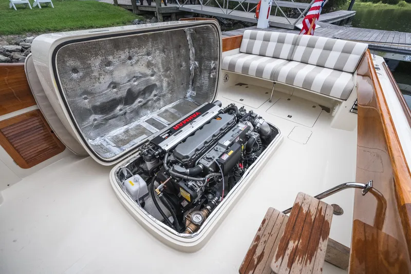 Slide: The Image of Hinckley Picnic Boat 36 Classic 2000 engine compartment with Yanmar engine and striped seating. - 43
