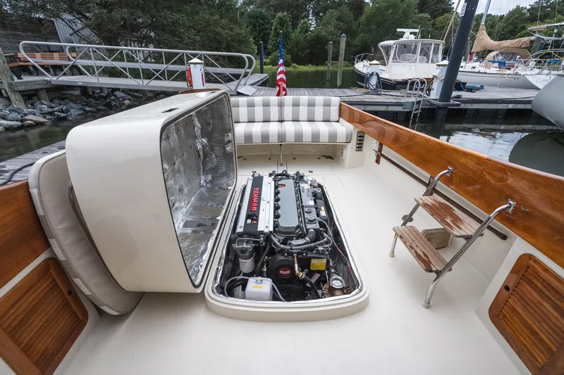 Slide: The Image of Hinckley Picnic Boat 36 Classic 2000 with open engine compartment, docked at marina. - 61
