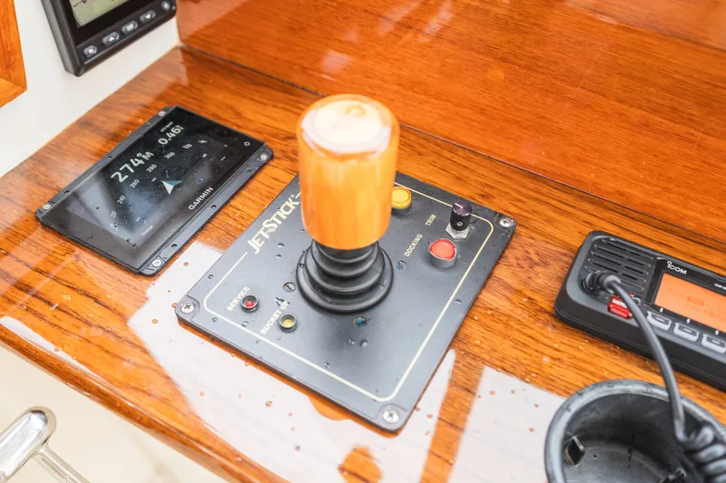 Slide: The Image of Control panel of a 2000 Hinckley Picnic Boat 36 Classic with joystick and navigation display. - 35
