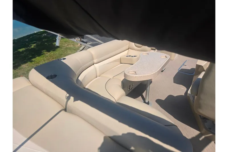 Slide: The Image of Luxurious seating area on a 2012 Manitou 25 Legacy pontoon boat. - 20