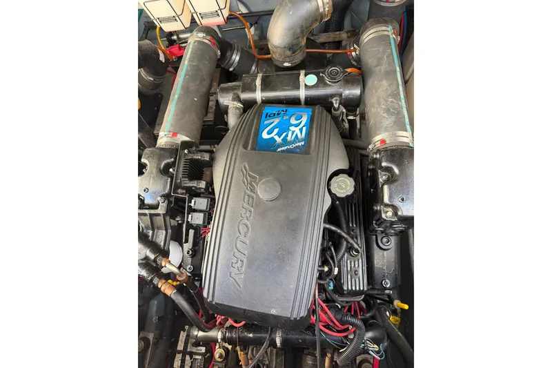 Slide: The Image of Engine of a 2002 Sea Ray 340 Sundancer boat, featuring Mercury components. - 17