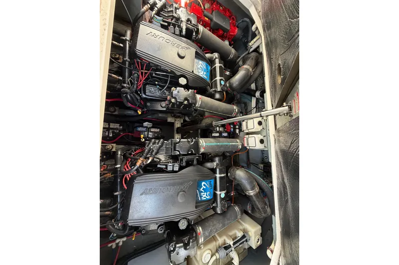 Slide: The Image of Engine compartment of a 2002 Sea Ray 340 Sundancer with Mercury engines. - 21