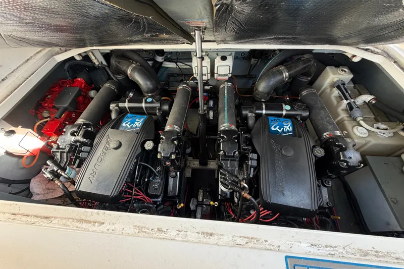 Slide: The Image of Engine compartment of a 2002 Sea Ray 340 Sundancer with twin Mercury engines. - 19