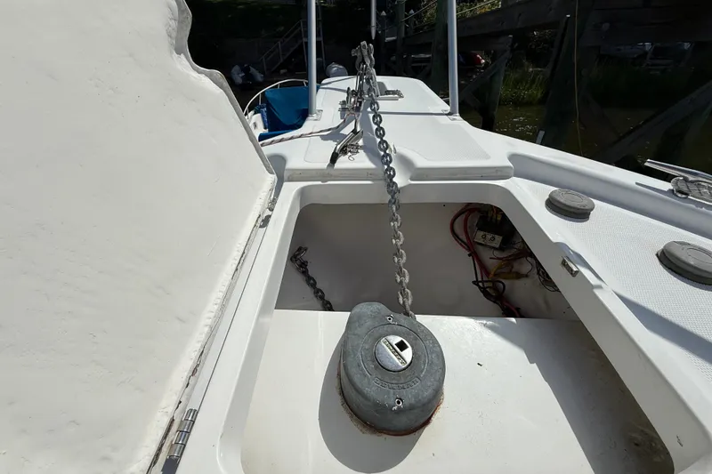 Slide: The Image of Anchor chain compartment on a 2000 Mainship Pilot 30 boat deck. - 6