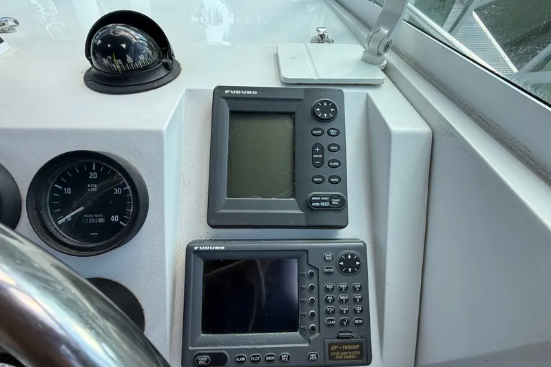 Slide: The Image of Boat dashboard with Furuno navigation systems and compass, Mainship Pilot 30, 2000 model. - 20