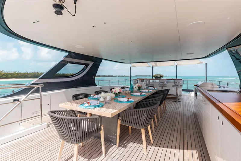 Slide: The Image of Luxurious dining area on 2023 Benetti Oasis 34 yacht with ocean view. - 32