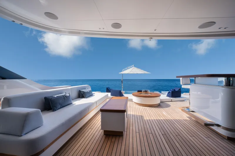 Slide: The Image of Luxurious 2023 Benetti Oasis 34 yacht deck with ocean view and elegant seating. - 11