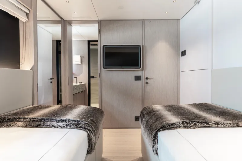 Slide: The Image of Luxurious interior of 2023 Benetti Oasis 34 yacht with twin beds and modern decor. - 27