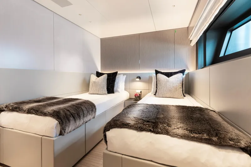 Slide: The Image of Luxurious twin bedroom on 2023 Benetti Oasis 34 yacht with modern decor. - 24
