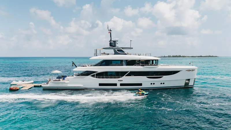 Slide: The Image of Luxury Benetti Oasis 34 yacht cruising in clear blue ocean, 2023 model. - 2