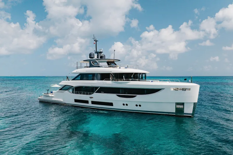 The Image of Luxurious 2023 Benetti Oasis 34 yacht cruising on clear blue ocean waters. - 1