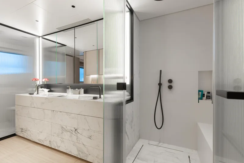 Slide: The Image of Luxurious bathroom on 2023 Benetti Oasis 34 yacht with marble finishes and modern fixtures. - 20