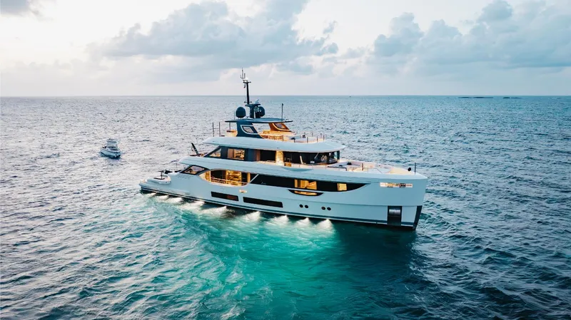 Slide: The Image of Luxury Benetti Oasis 34 yacht cruising on the ocean at sunset, 2023 model. - 3