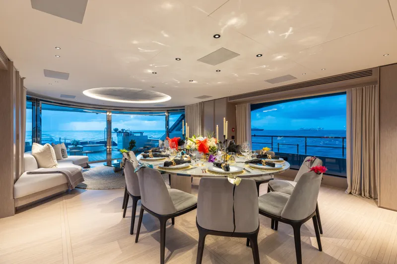 Slide: The Image of Luxurious dining area on 2023 Benetti Oasis 34 yacht with ocean view and elegant decor. - 15