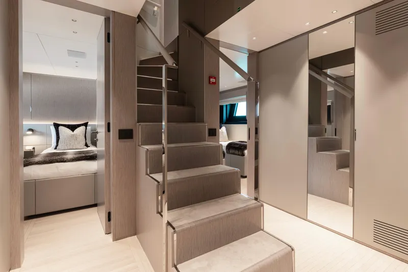 Slide: The Image of Luxurious interior of 2023 Benetti Oasis 34 yacht with modern staircase and elegant bedroom. - 23