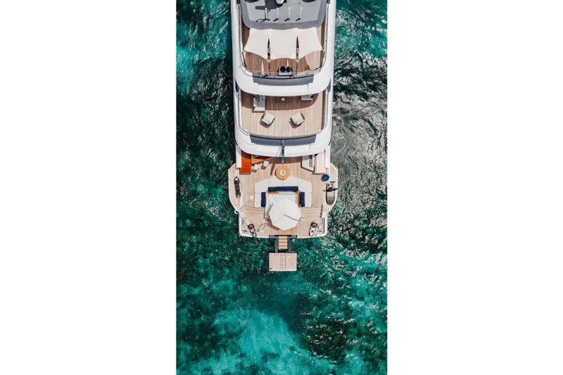 Slide: The Image of Aerial view of 2023 Benetti Oasis 34 yacht on turquoise water. - 5