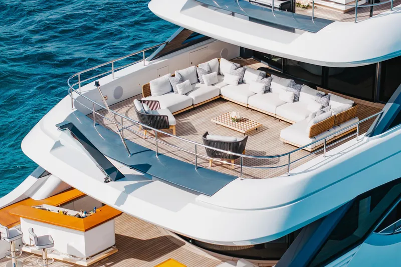 Slide: The Image of Luxurious 2023 Benetti Oasis 34 yacht deck with elegant seating and ocean view. - 6