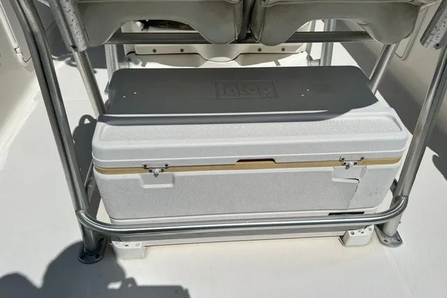 Slide: The Image of White cooler on Wellcraft 252 Fisherman boat, 2004 model, secured under metal frame. - 17