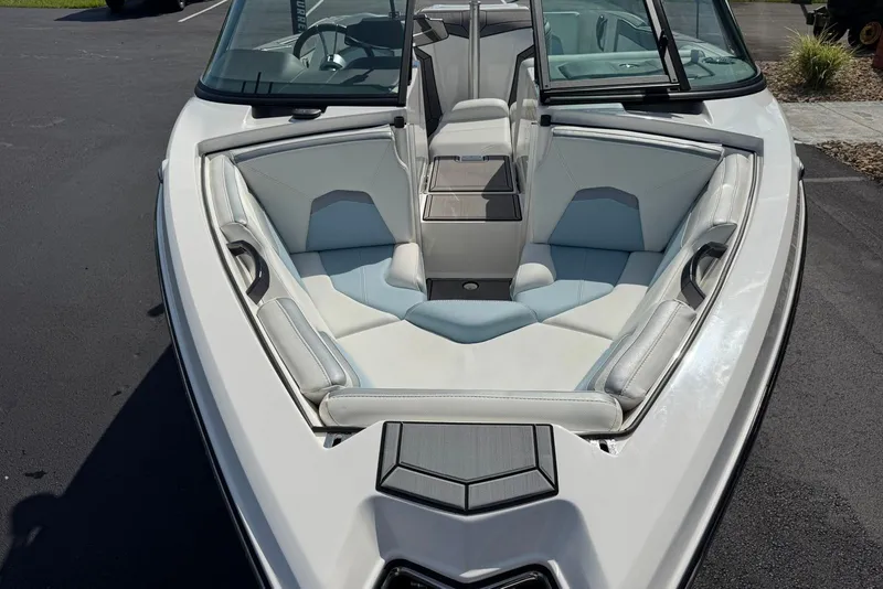 Slide: The Image of 2023 MasterCraft ProStar boat with sleek interior design and comfortable seating. - 5