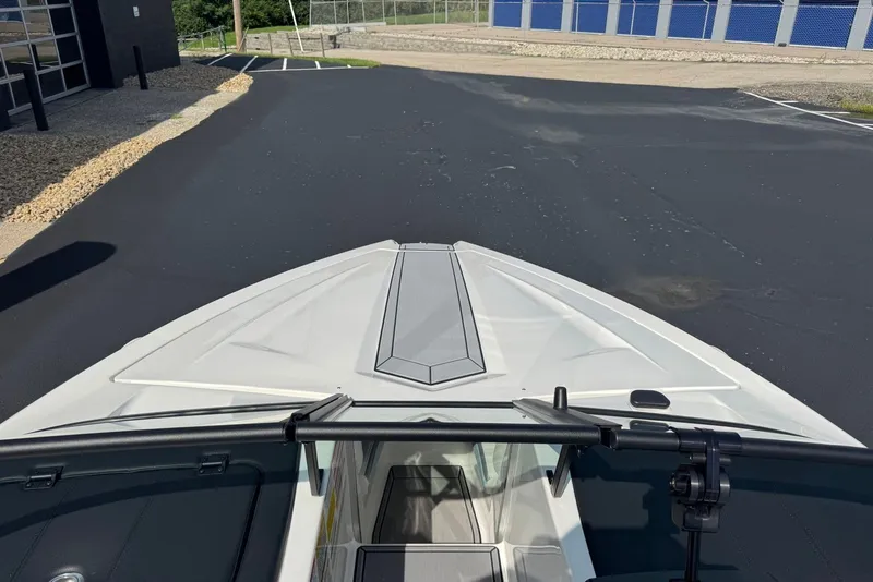 Slide: The Image of 2023 MasterCraft ProStar boat bow view in a parking lot. - 6