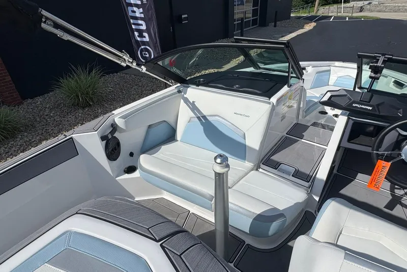 Slide: The Image of 2023 MasterCraft ProStar boat interior with sleek seating and modern design. - 7