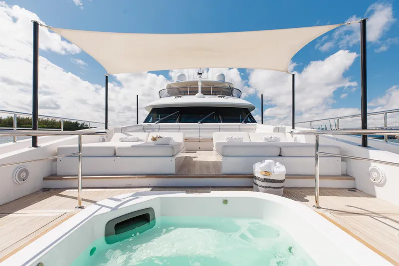 Slide: The Image of Luxurious 2018 Benetti Fast 125 yacht deck with jacuzzi and sunshade under blue sky. - 37