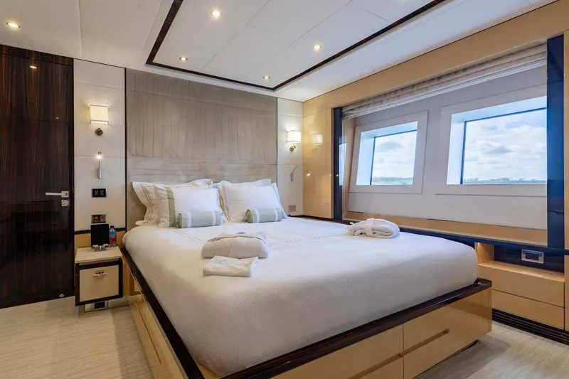 Slide: The Image of Luxurious bedroom interior on 2018 Benetti Fast 125 yacht, featuring elegant design and large windows. - 22