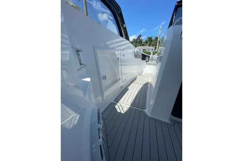 Slide: The Image of 2024 NX Boats NX280 XTREME deck view with sleek design and modern features. - 12
