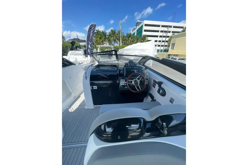 Slide: The Image of 2024 NX Boats NX280 XTREME cockpit with modern controls and sleek design. - 11