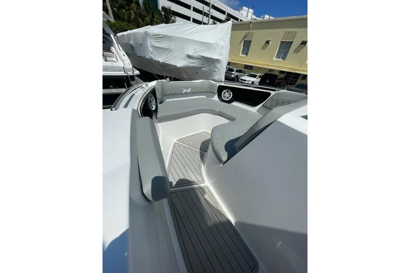 Slide: The Image of 2024 NX Boats NX280 XTREME interior with sleek seating and modern design. - 5