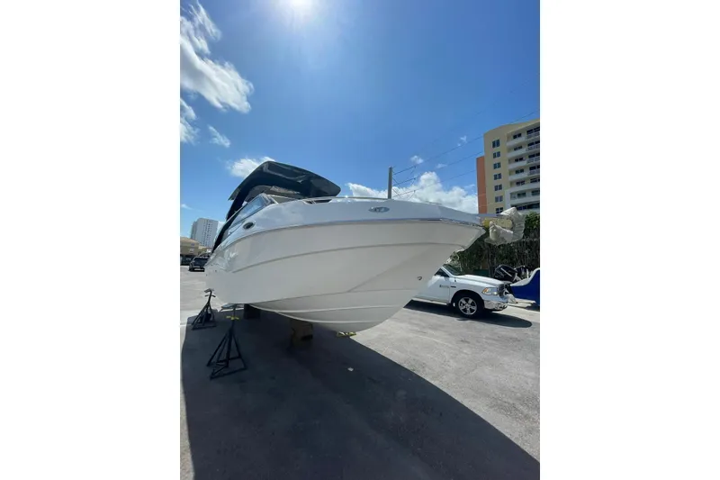 The Image of 2024 NX Boats NX280 XTREME on display under clear blue sky. - 1